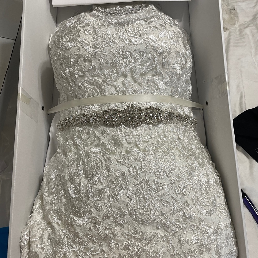 Lace wedding gown with belt and tiara